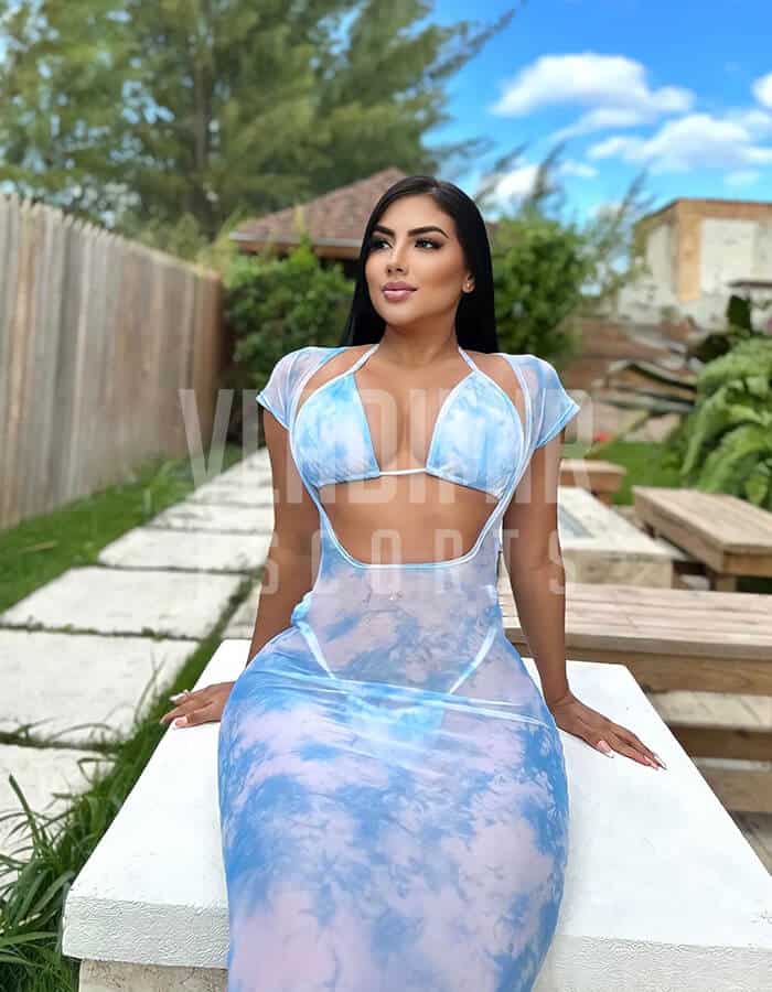 sexy escort Bahamas latina in blue dress available for bookings