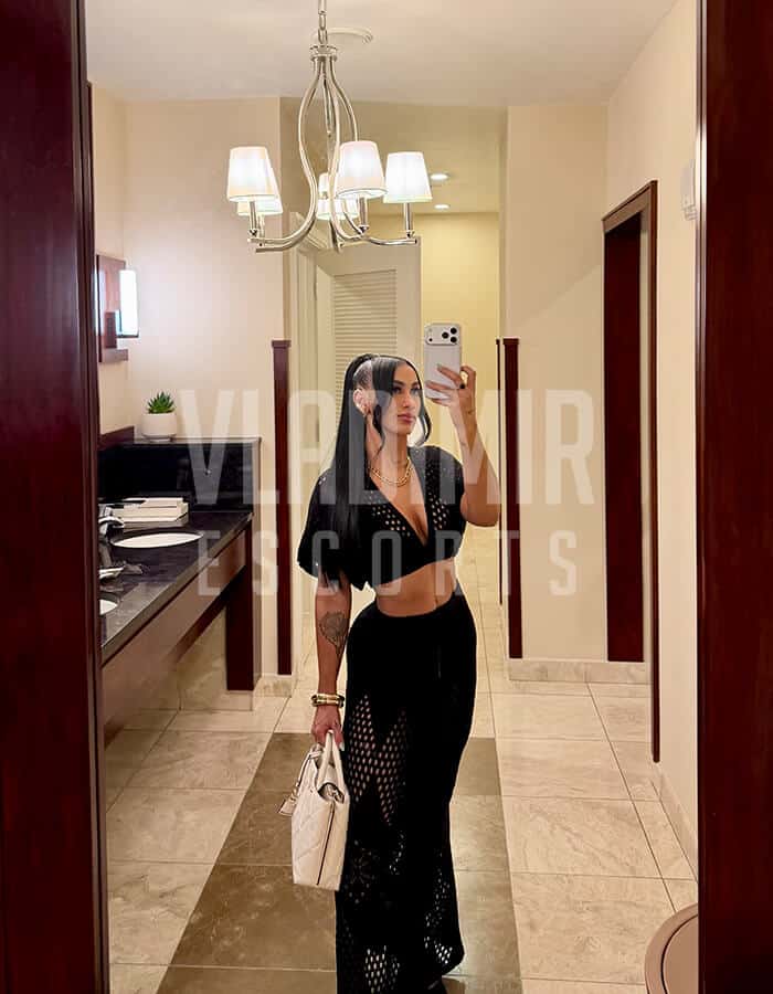 Glamorous woman in stylish evening wear enjoying an upscale nightlife experience